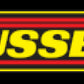 Russell Performance Adpt Fitting 3/8in SAE Qck Dis Male to #8 SAE Port Male Swvl End 90 Deg Blk Anod